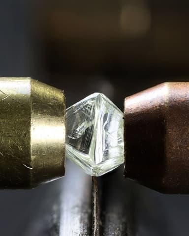 Inspecting rough diamonds under a high-powered microscope